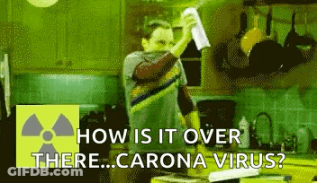 Man In Kitchen Holding Paper Asking How Is It Over There Corona Virus GIF