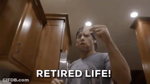 Man In Kitchen Holding Paper Saying Retired Life GIF