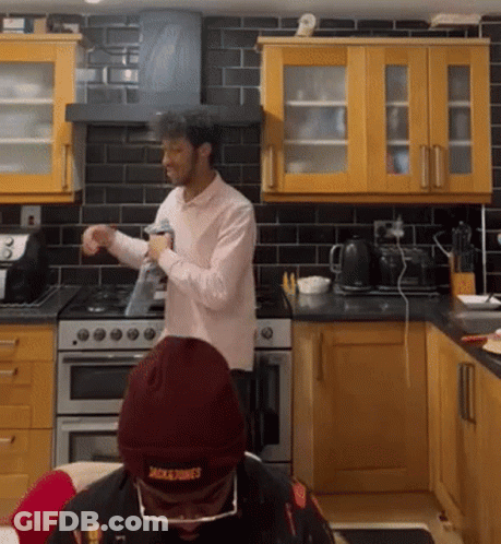 Man In Kitchen Wearing Jacksons Beanie GIF
