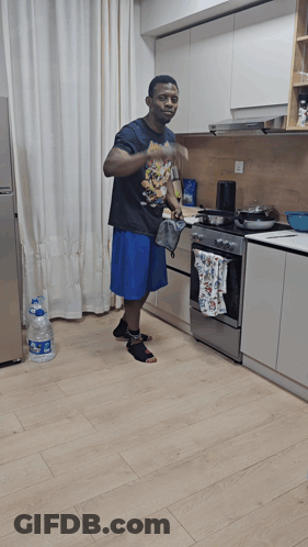 Man In Kitchen Wearing Nintendo T-Shirt GIF