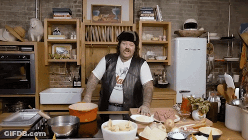 Man In Kitchen Wearing T-Shirt That Says I Love Italy GIF