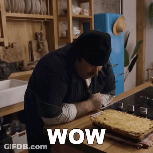 Man In Kitchen With Casserole Dish Wow GIF