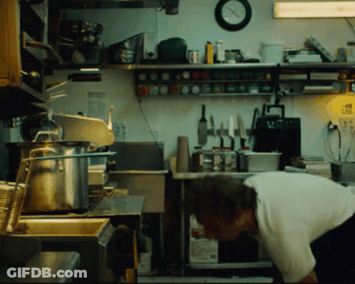 Man In Kitchen With Clock GIF