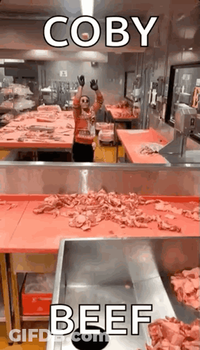 Man In Kitchen With Meat Conveyor GIF