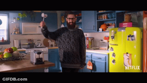 Man In Kitchen With Netflix Sign On Refrigerator GIF