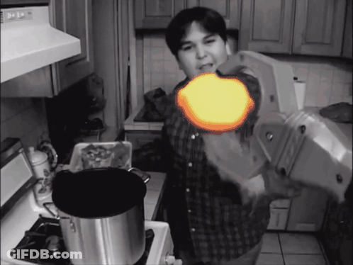 Man In Kitchen With Pot GIF