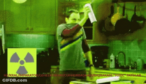 Man In Kitchen With Radioactive Symbol GIF