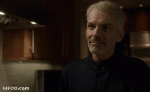 Man In Kitchen With Word Aces Above Head GIF