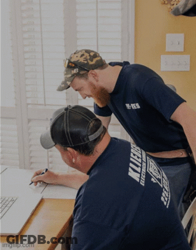 Man In Klein Electrical Works Shirt GIF