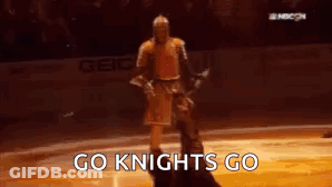 Man In Knight Costume On Ice Rink GIF