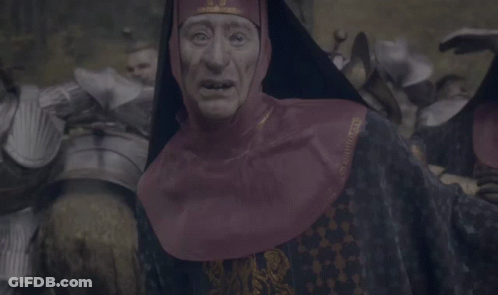 Man In Knight's Armor Facing Crowd GIF