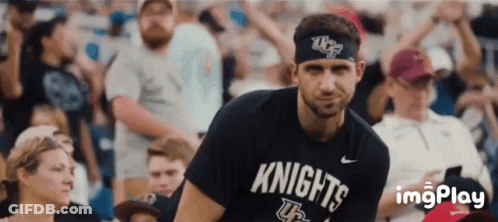 Man In Knights Shirt In Front Of Crowd GIF