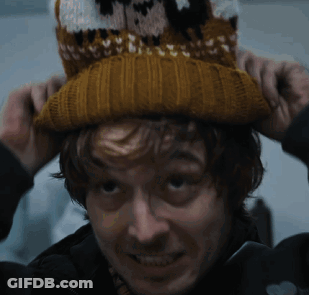 Man In Knitted Hat With Sheep GIF