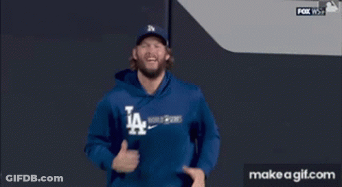 Man In LA Dodgers Sweatshirt Running On Baseball Field GIF