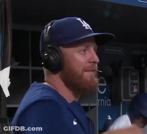 Man In LA Hat And Headphones Talking Into Microphone GIF
