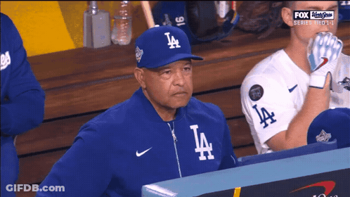 Man In LA Hat In Dugout GIF