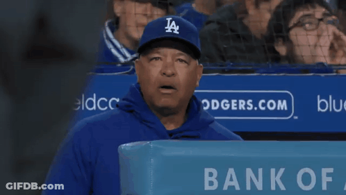 Man In LA Hat In Front Of Bank Of America Sign GIF