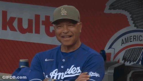 Man In LA Hat In Front Of Bank Of America Sign GIF