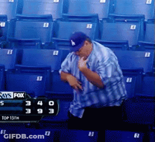 Man In LA Hat In Front Of Fox Scoreboard GIF