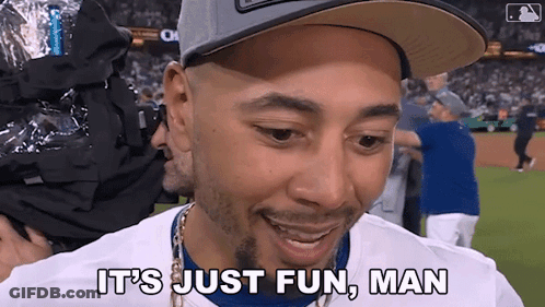 Man In LA Hat In Front Of Scoreboard GIF