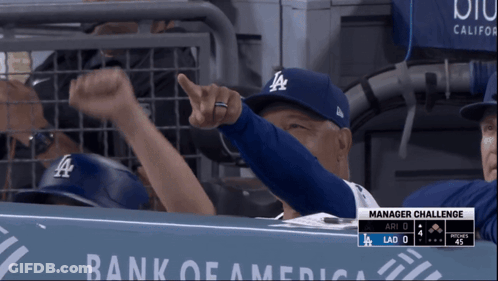 Man In LA Hat Pointing At Camera GIF