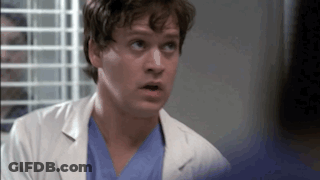 Man In Lab Coat And Scrubs Looking Up GIF