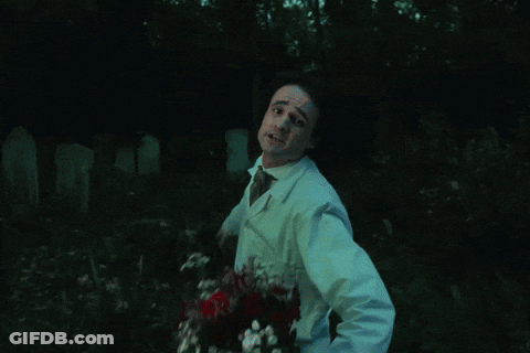 Man In Lab Coat And Tie Dancing In Dark GIF