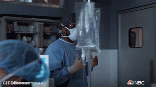 Man In Lab Coat And Tie With Newamsterdam Name Tag GIF