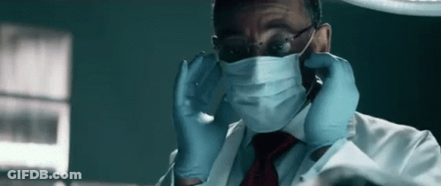 Man In Lab Coat And Tie With Surgical Mask And Gloves GIF