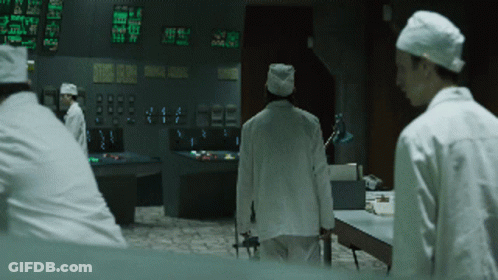 Man In Lab Coat At Control Panel Saying Static Display GIF