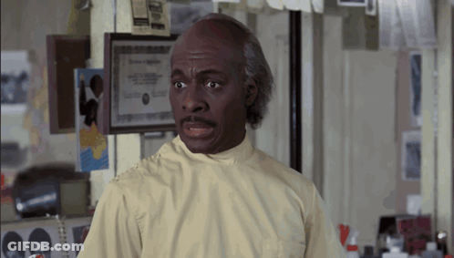Man In Lab Coat By Framed Certificate GIF