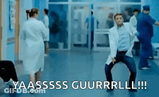 Man In Lab Coat Dancing In Hospital Hallway With Nurse GIF