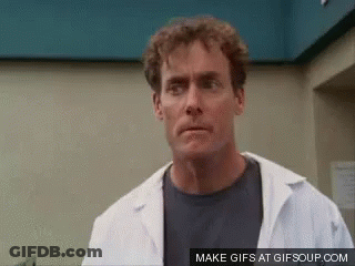 Man In Lab Coat Making Funny Face GIF