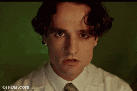 Man In Lab Coat Making Sad Face GIF