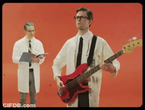 Man In Lab Coat Playing Red Bass Guitar GIF