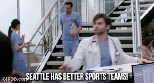 Man In Lab Coat Says Seattle Has Better Sports Teams GIF