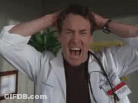 Man In Lab Coat Screaming With Hands On Head GIF