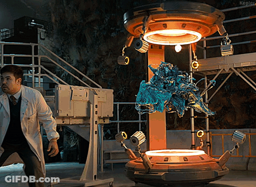 Man In Lab Coat Standing In Front Of Kepler Machine GIF