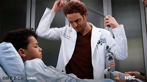 Man In Lab Coat Talking To Boy In Hospital Bed #ChicagoMed GIF