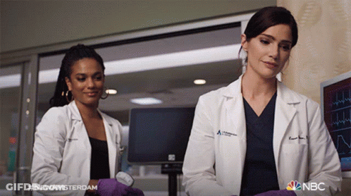 Man In Lab Coat Talking To Man In Scrubs #NewAmsterdam GIF