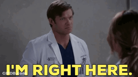 Man In Lab Coat Talking To Woman In Hospital Room GIF