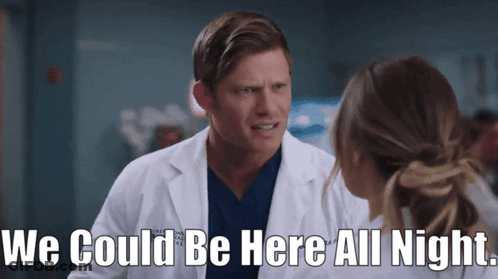 Man In Lab Coat Talking To Woman Says We Could Be Here All Night GIF