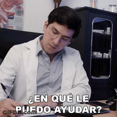 Man In Lab Coat Writing En Que Le Puedo Ayudar GIF