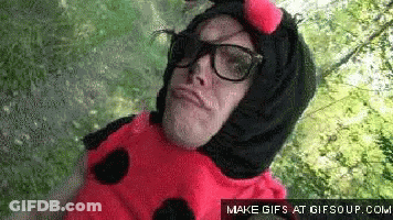 Man In Ladybug Costume With Glasses Making Face GIF