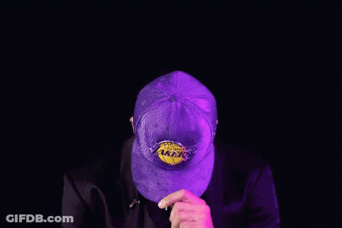 Man In Lakers Hat And Suit Making A Face GIF