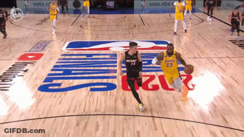 Man In Lakers Jersey Dribbling Ball GIF