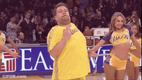 Man In Lakers Jersey Next To Cheerleader GIF