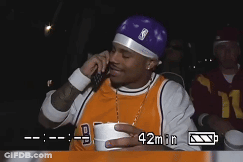 Man In Lakers Jersey Talking On Phone GIF