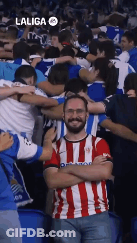 Man In Laliga Shirt Standing In Crowd GIF