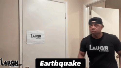 Man In Laugh Nation Shirt At Door GIF